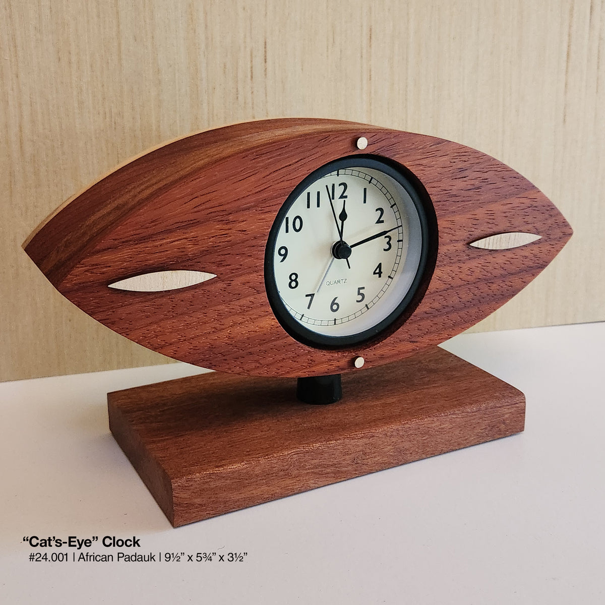 "Cat's-Eye Clock - African Padauk"