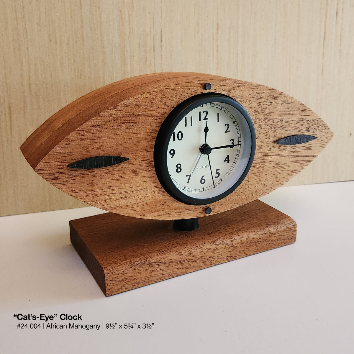 "Cat's-Eye Clock - African Mahogany"