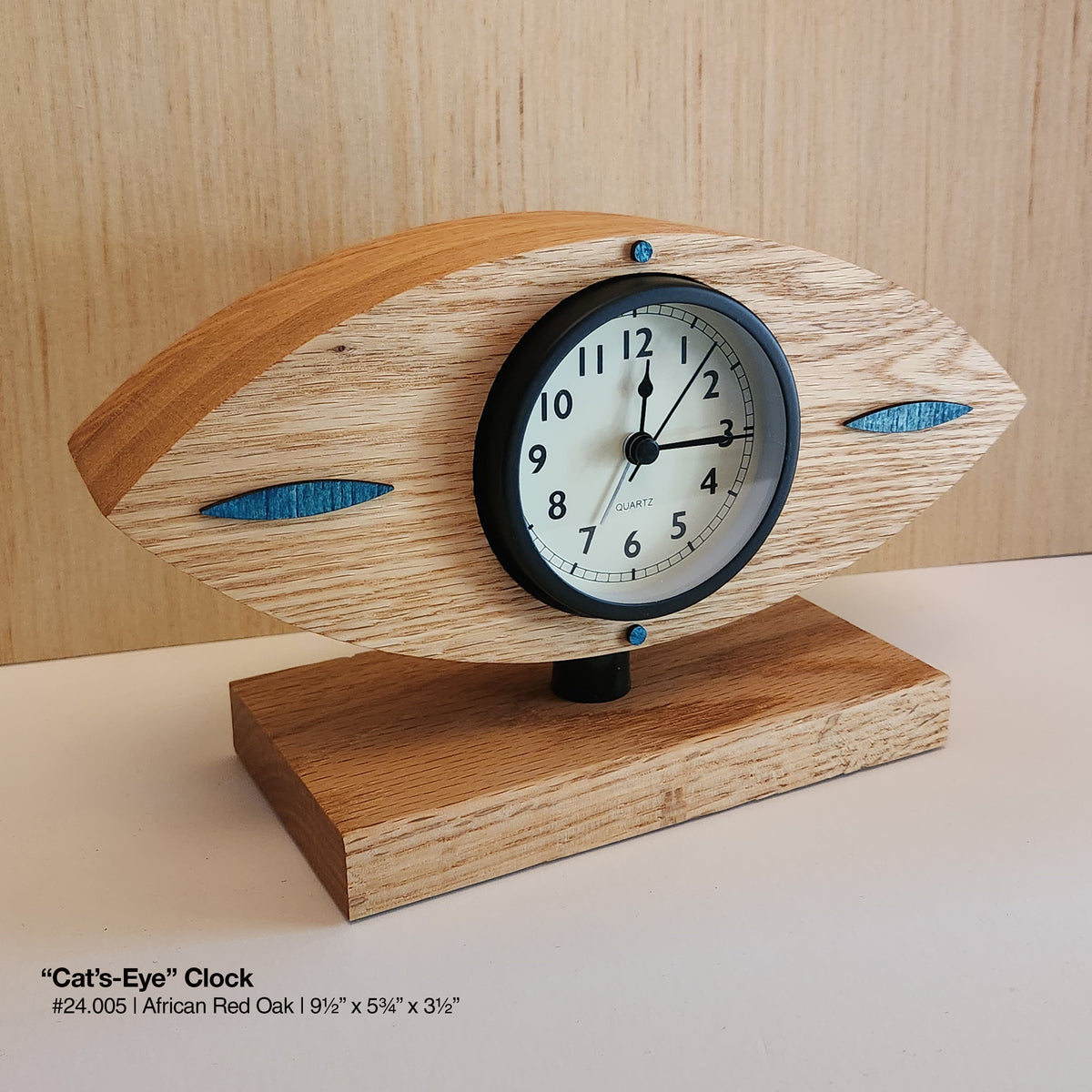 "Cat's-Eye Clock - Red Oak"